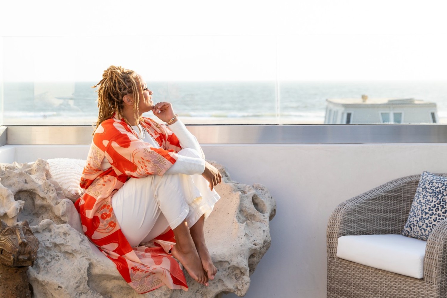 Breegan Jane recently redid her fabulous beach house. Here she is relaxing on her deck and enjoying coastal views."