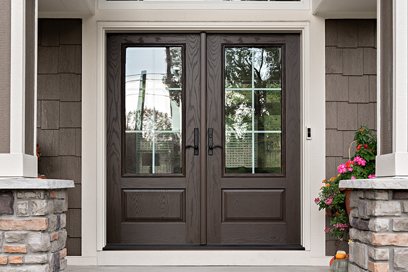 Double door featuring a central window, allowing light to pass through while maintaining privacy.