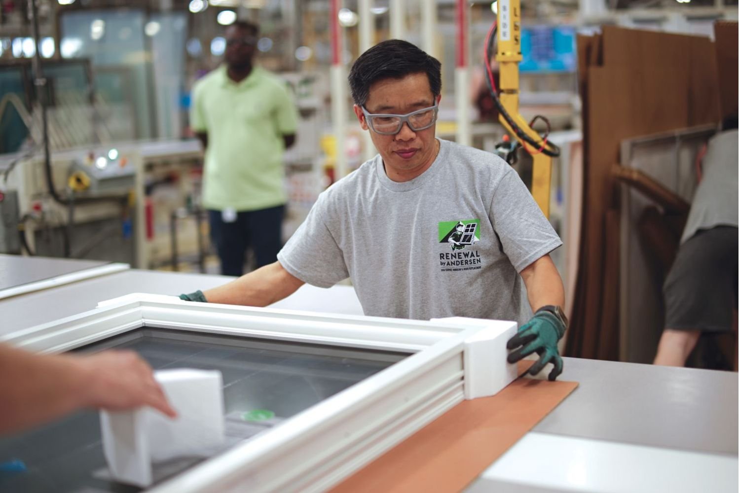 A Renewal by Andersen manufacturer working on a casement window
