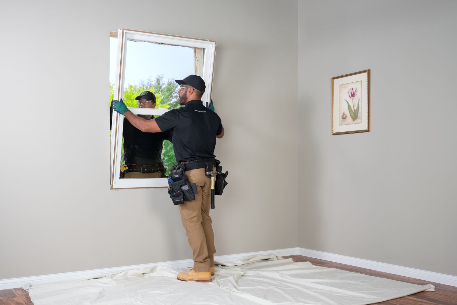 Renewal by Andersen Window replacement experts installing a window