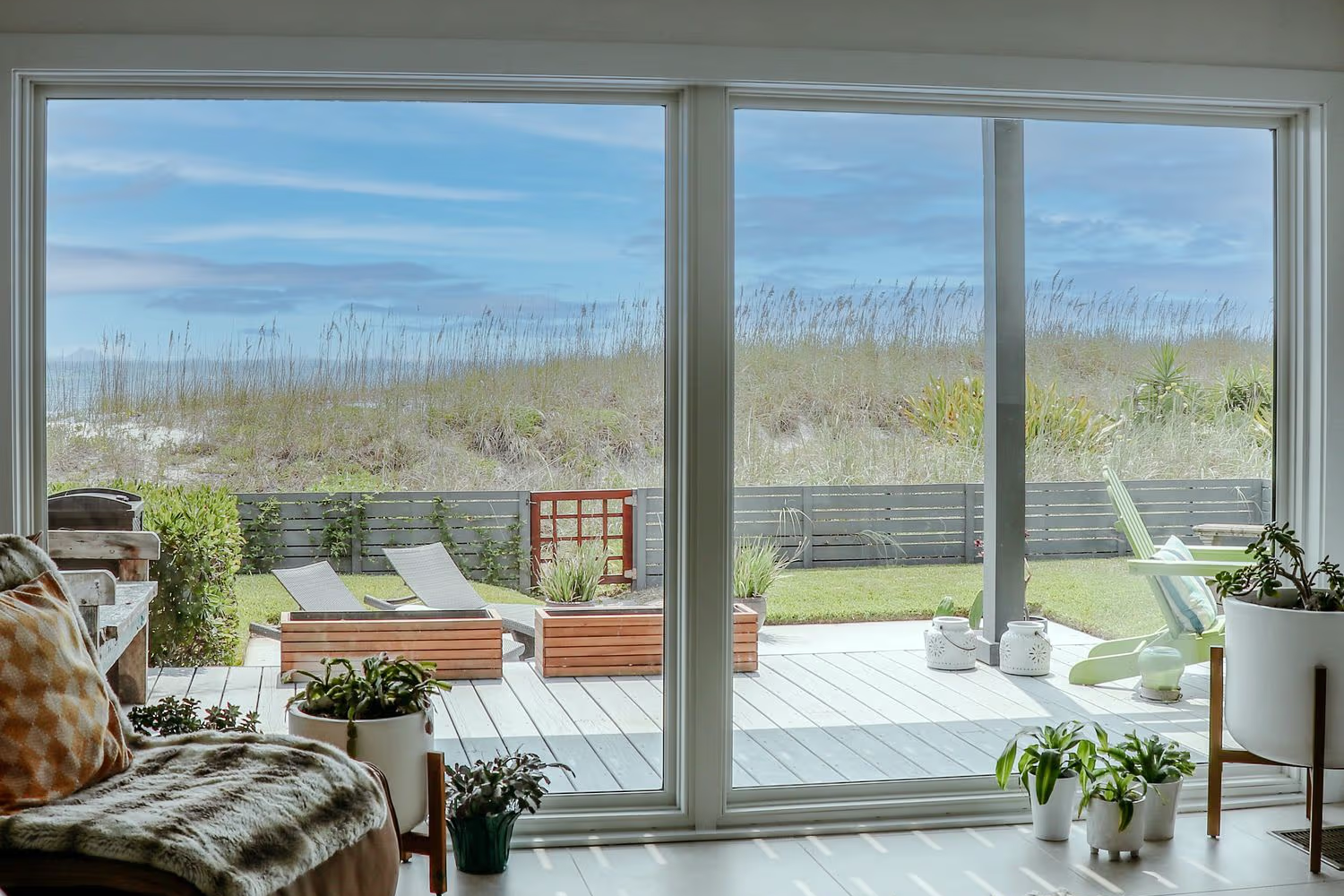 Interior view of a picture window acclaim impact outlooking the backyard