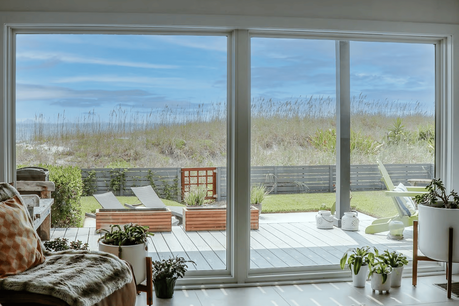 Interior view of a picture window acclaim impact outlooking the backyard