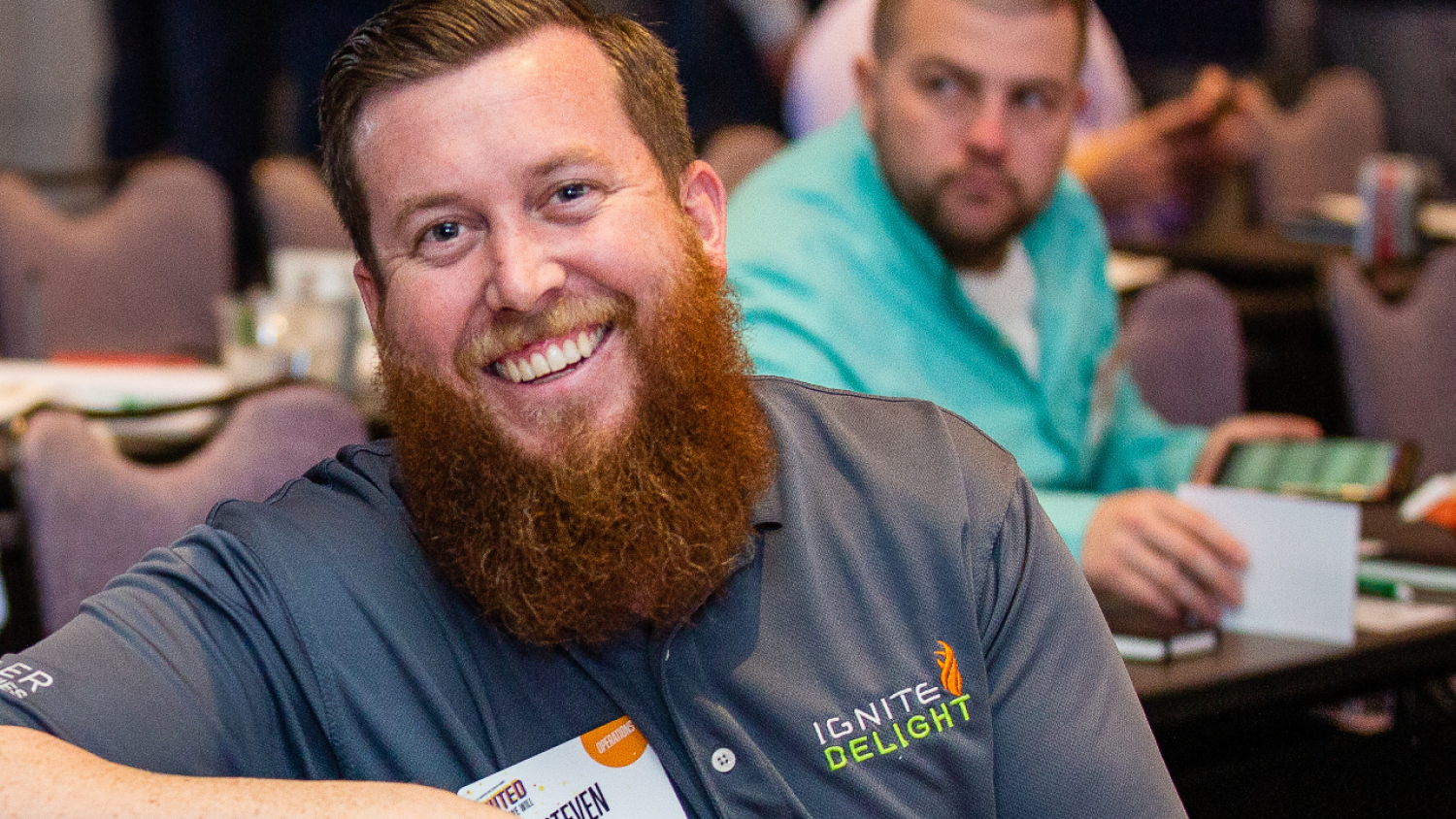 A Renewal by andersen difference maker sitting at one of our many conferences that celebrate our marketing department