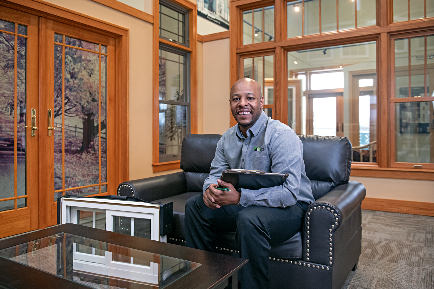 Renewal by Anderson Salesperson sitting on a couch