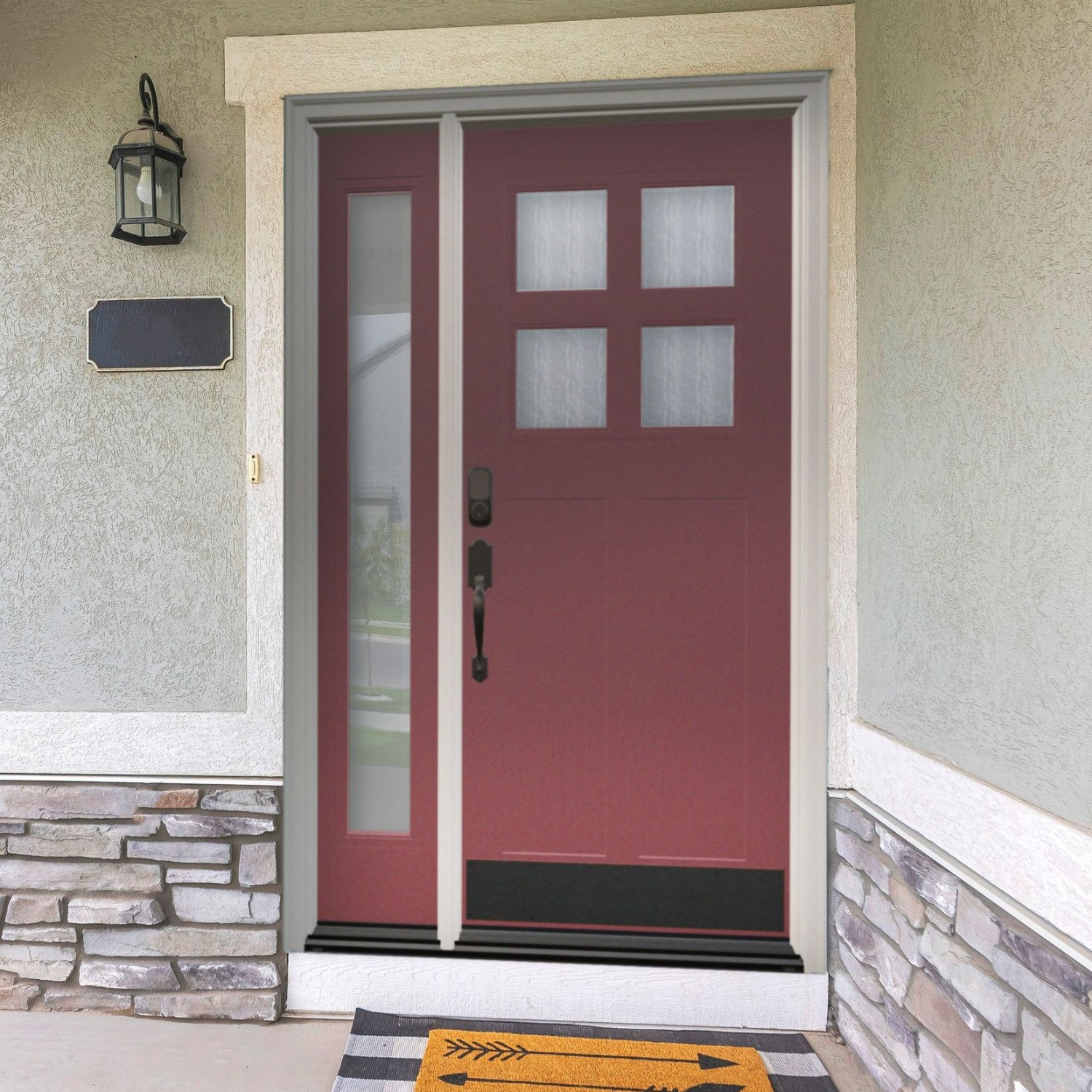 A single panel Ensemble entry door. The door is a brick red color with four small square glass panels in a larger square at the top. One sidelight, full length, off to the left.