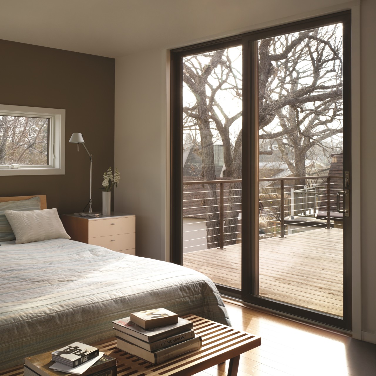 Black permashield patio doors. These sliding patio doors are very modern and open to the deck off the bedroom.
