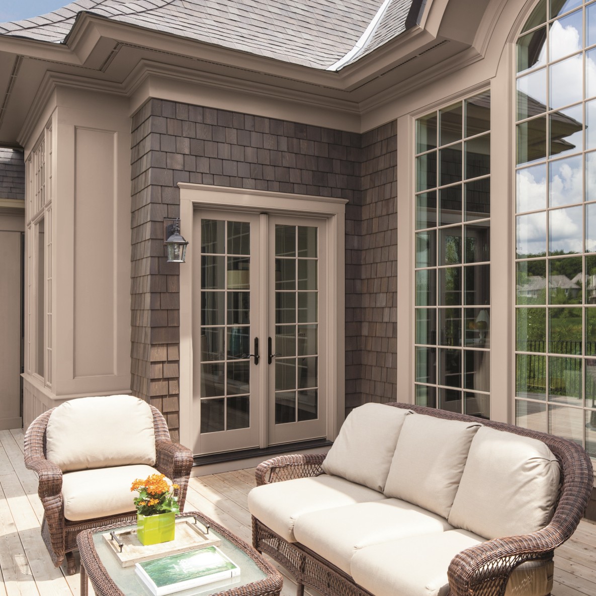 A set of french doors in Sandtone color. These french doors have colonial grilles.