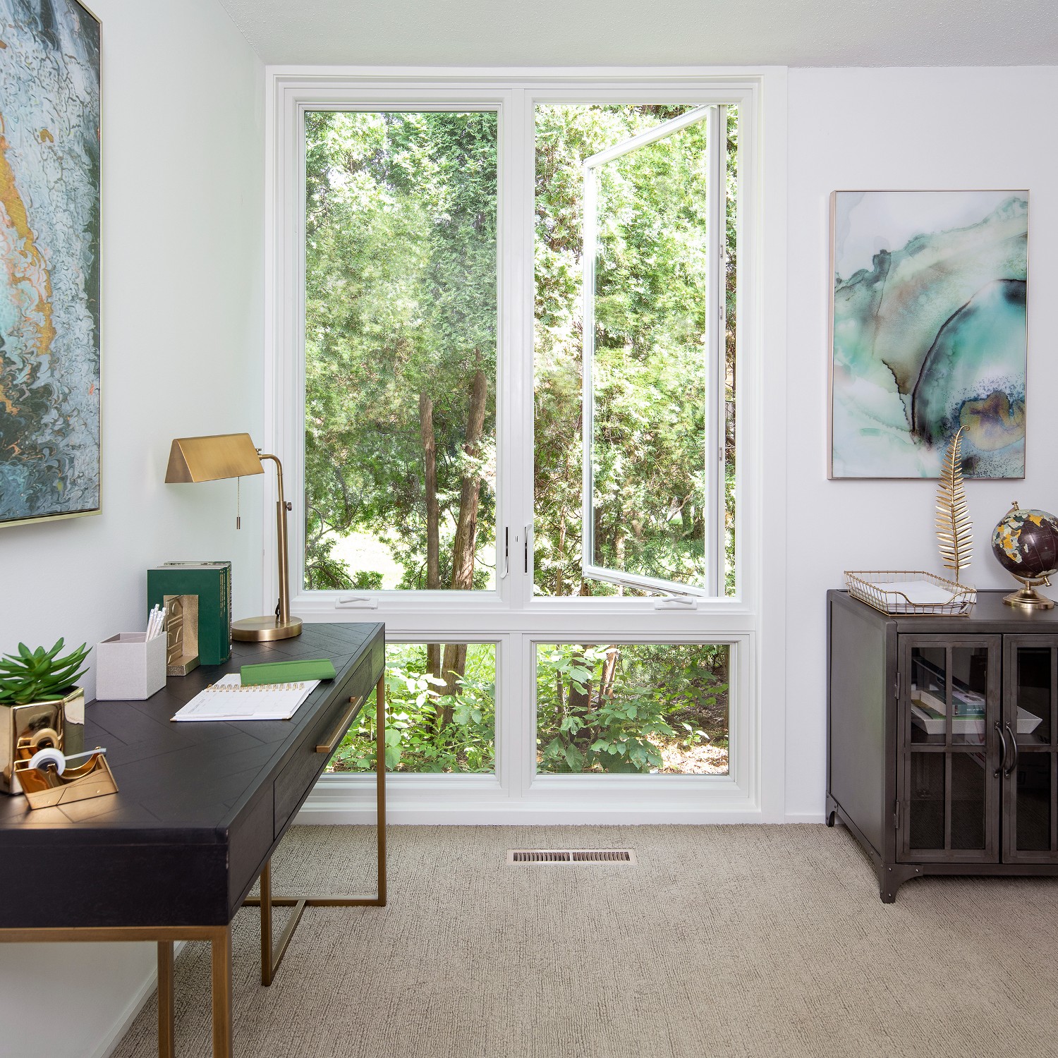A bedroom with white casement windows on top and awning windows underneath.