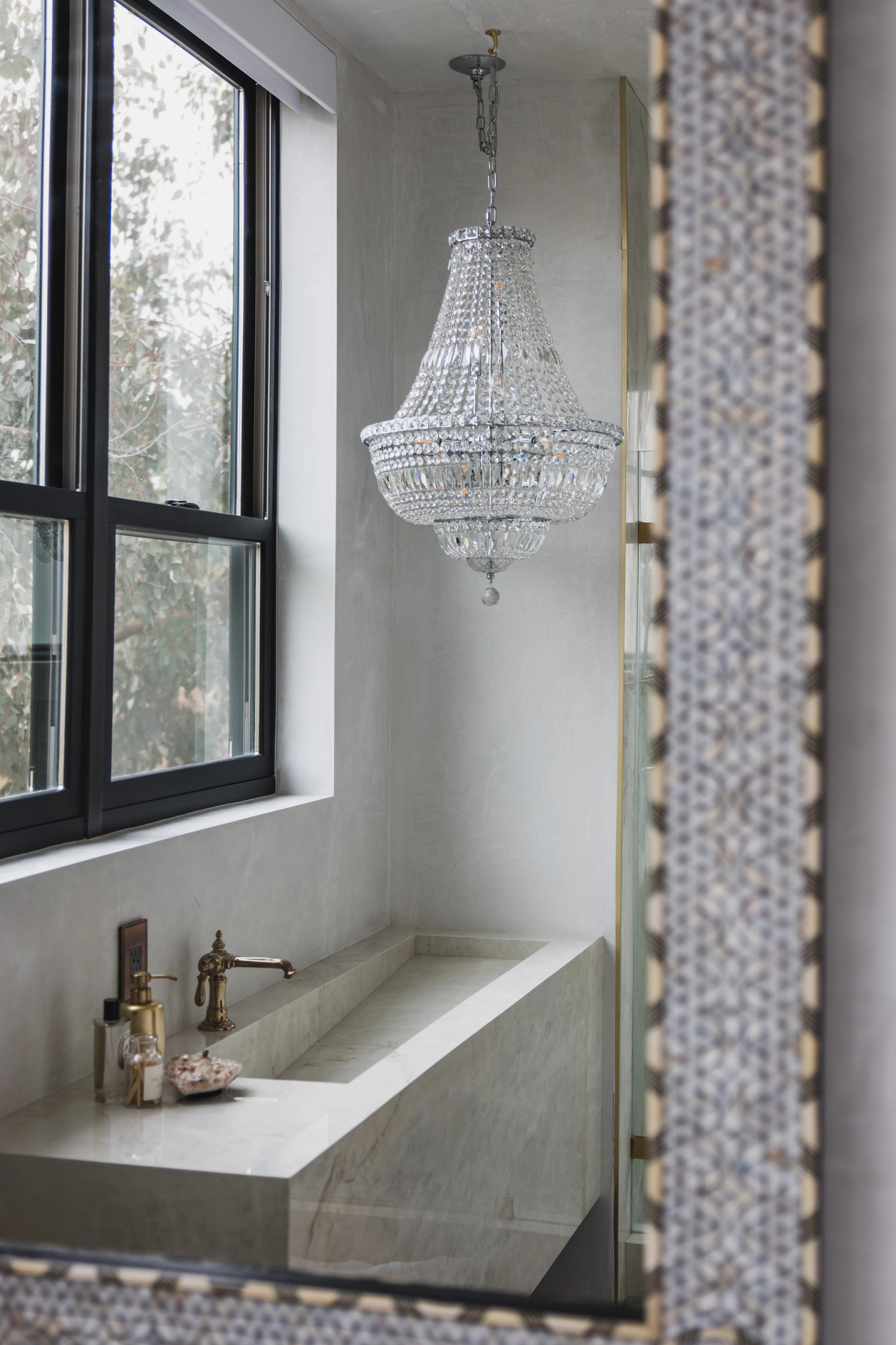 A bathroom showing a window and a tub