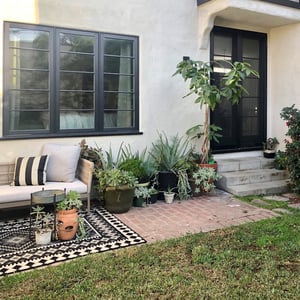 Casement windows and an a-series patio door overlooking the patio and courtyard.