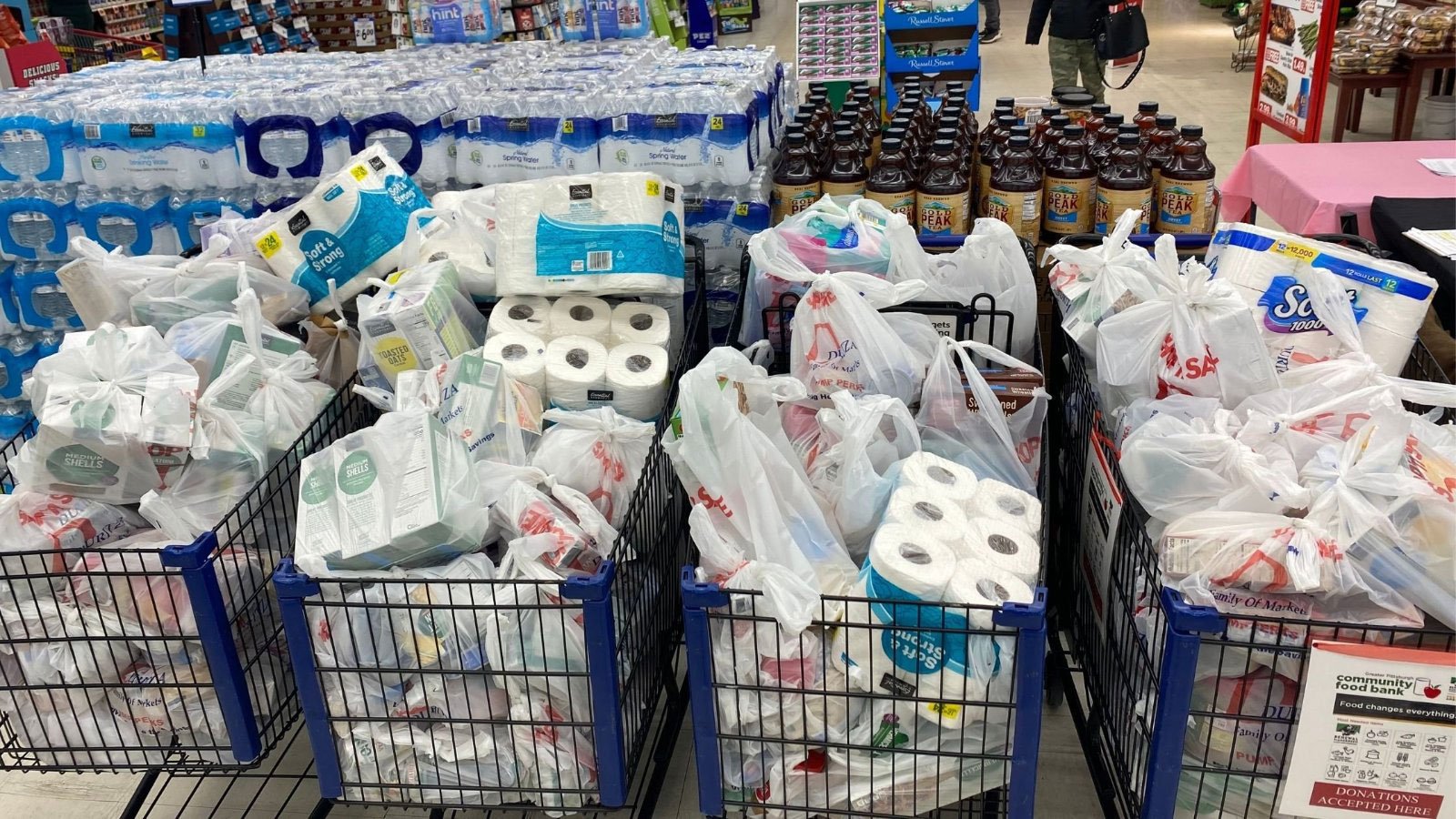 Shopping carts filled with food and home goods