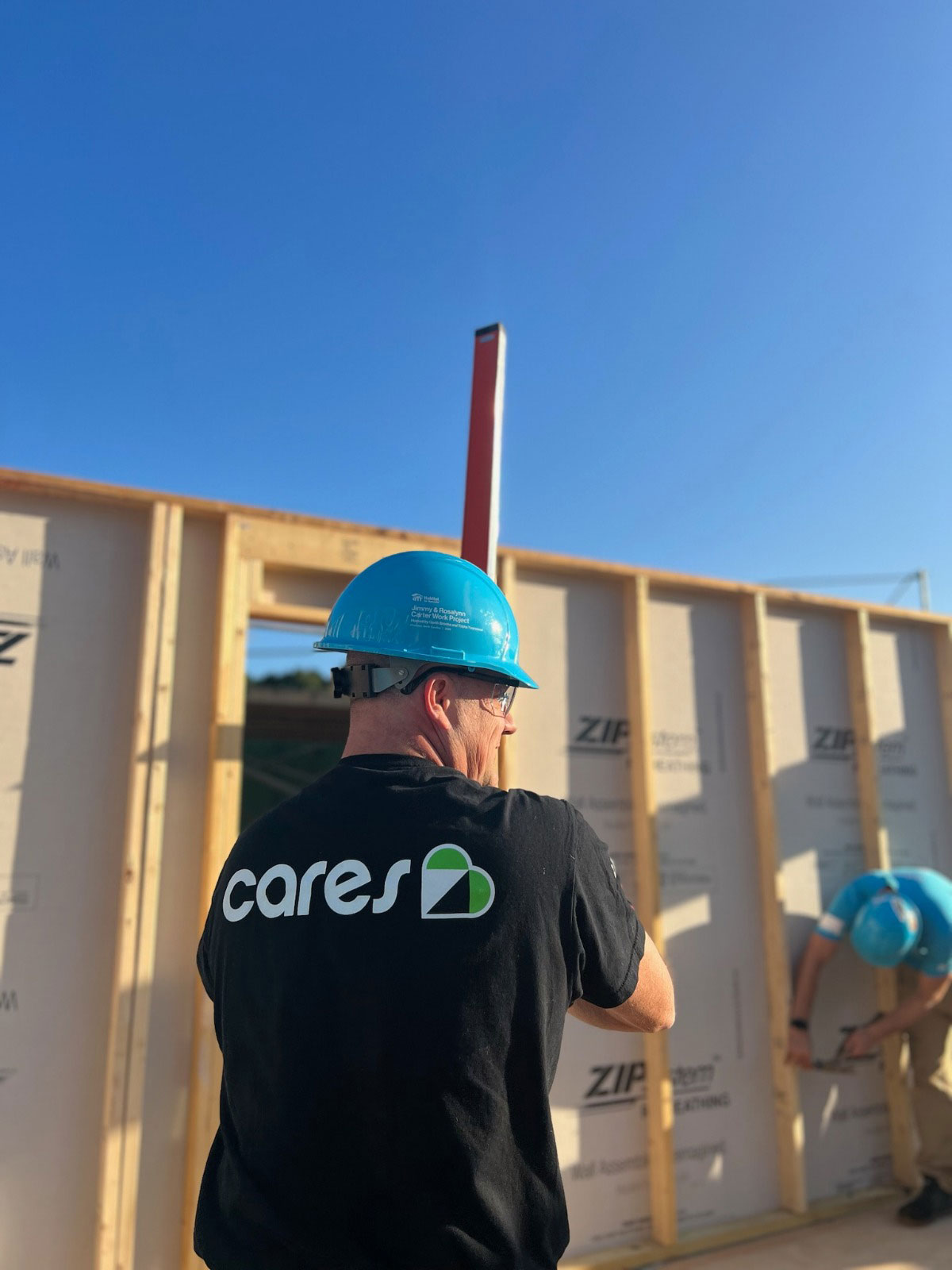 Renewal by Andersen volunteers work on Habitat for Humanity Carter Project